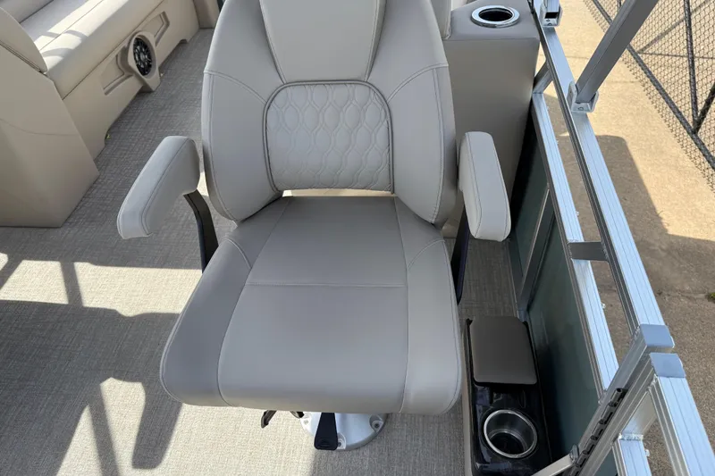 Slide: The Image of Luxurious seating on 2026 Avalon VENTURE QUAD LOUNGE boat with cup holder and armrests. - 89