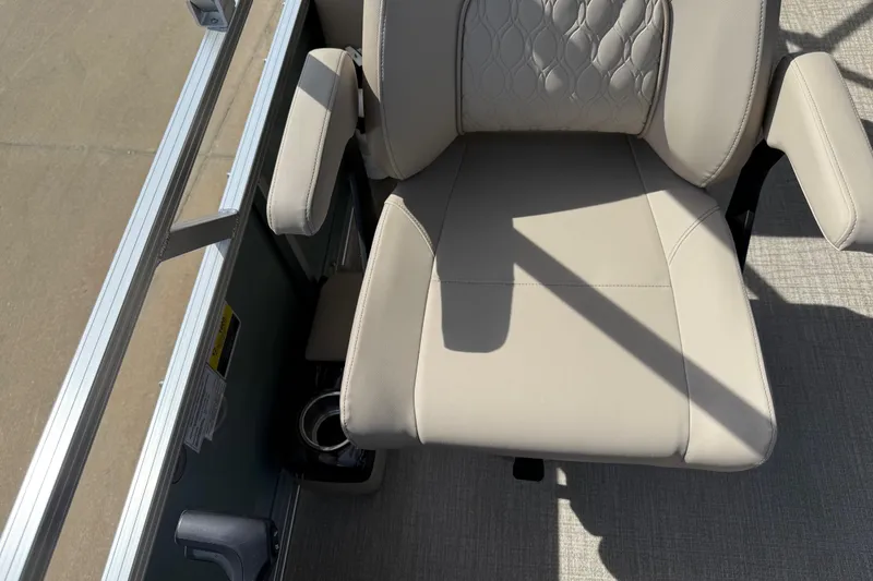 Slide: The Image of Beige seat on 2026 Avalon VENTURE QUAD LOUNGE boat, featuring armrests and textured upholstery. - 91