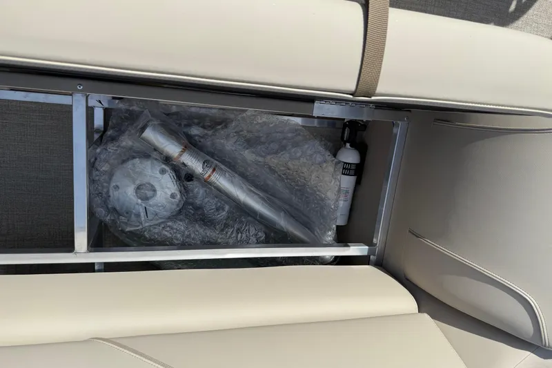 Slide: The Image of Storage compartment in 2026 Avalon VENTURE QUAD LOUNGE with wrapped components and fire extinguisher. - 92