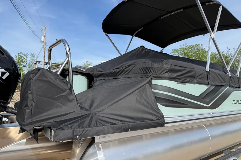 Slide: The Image of 2026 Avalon VENTURE QUAD LOUNGE pontoon boat with protective cover and canopy. - 99