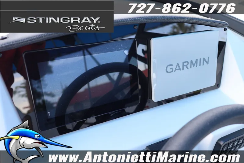 Slide: The Image of 2026 Stingray 211 DC boat dashboard featuring Garmin navigation system. - 10