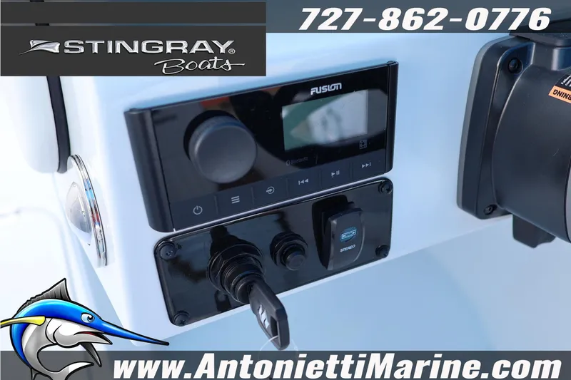 Slide: The Image of Dashboard of 2026 Stingray 211 DC boat with Fusion stereo system. - 11