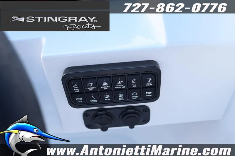 Slide: The Image of Control panel of 2026 Stingray 211 DC boat with various function buttons. - 12