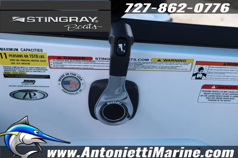 Slide: The Image of 2026 Stingray 211 DC boat controls with safety labels and contact information. - 13