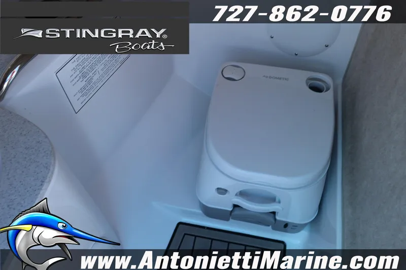 Slide: The Image of 2026 Stingray 211 DC boat interior with portable toilet, featuring Antonietti Marine branding. - 18