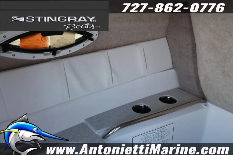 Slide: The Image of Interior of 2026 Stingray 211 DC boat with cup holders and seating. - 19