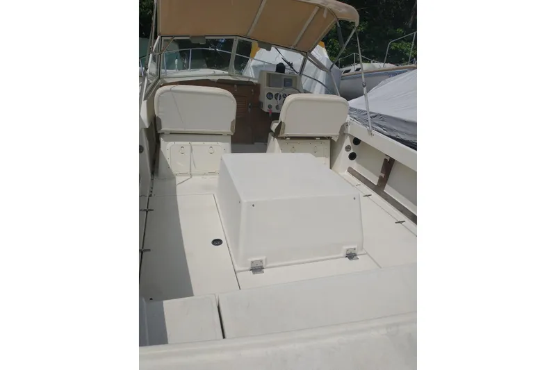 Slide: The Image of 2004 Limestone 24 Runabout boat interior with seating and dashboard view. - 2