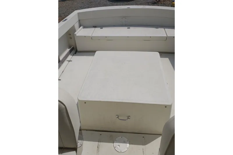Slide: The Image of 2004 Limestone 24 Runabout boat interior with seating and storage compartment. - 3