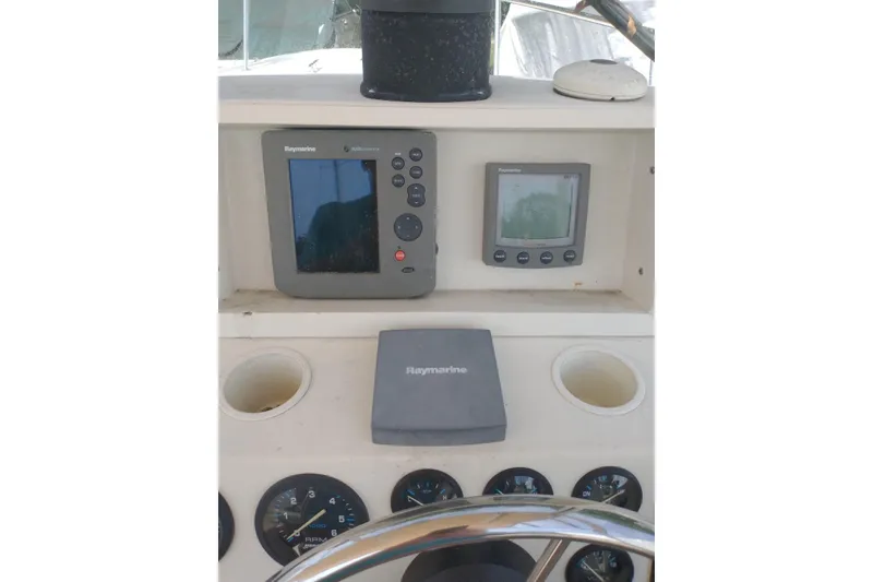 Slide: The Image of 2004 Limestone 24 Runabout dashboard with Raymarine navigation equipment. - 4