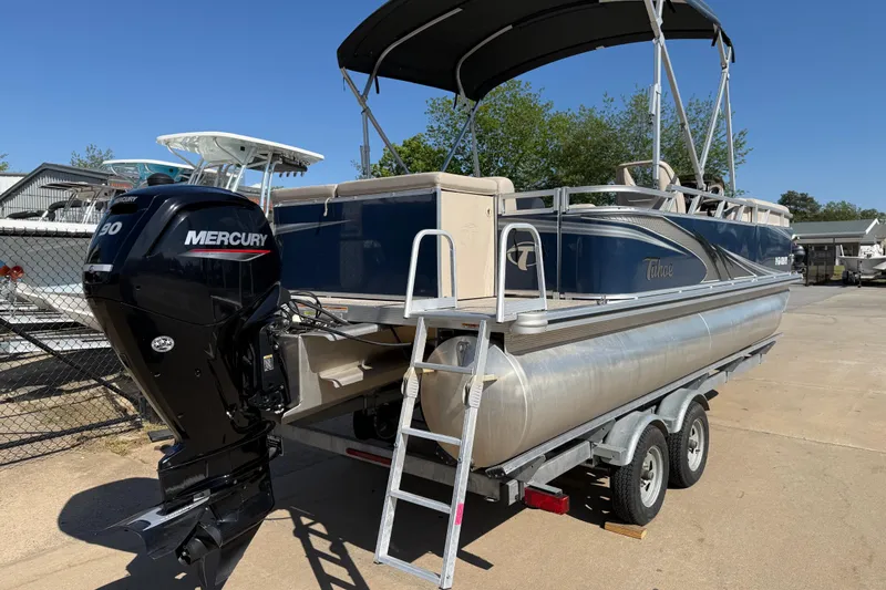 Slide: The Image of 2022 Tahoe Pontoon Sport Cruise boat with Mercury engine on trailer. - 11