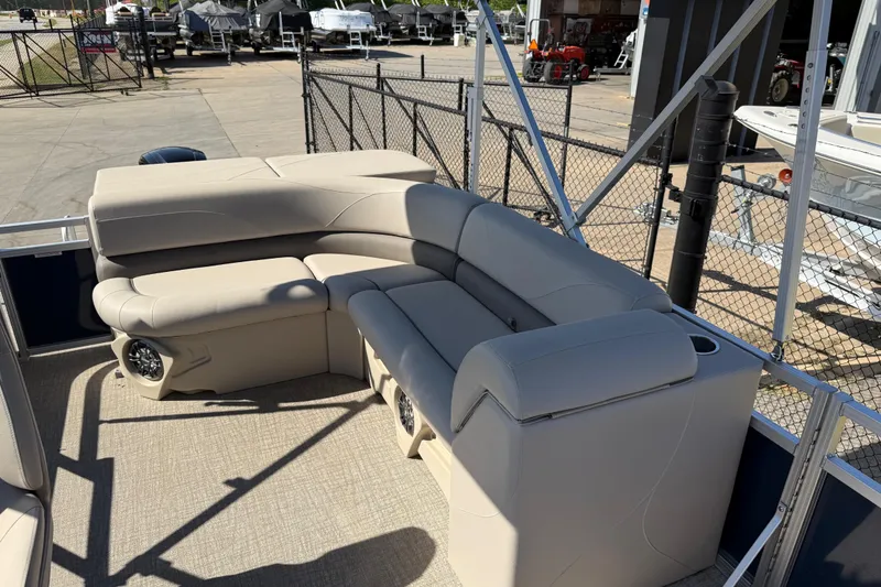 Slide: The Image of 2022 Tahoe Pontoon Sport Cruise with beige seating and speaker system. - 18