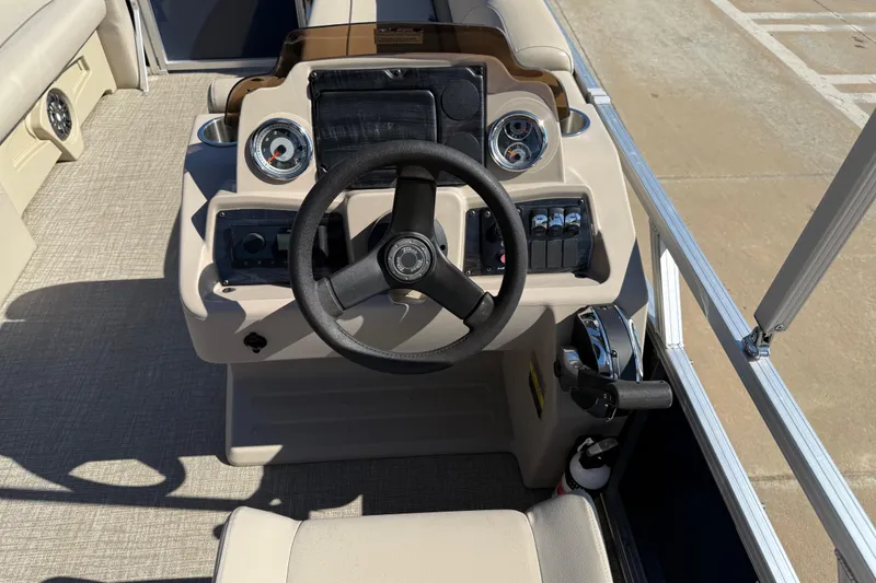 Slide: The Image of Steering console of 2022 Tahoe Pontoon Sport Cruise boat with gauges and controls. - 21