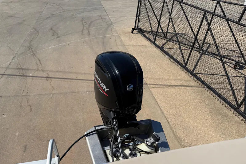 Slide: The Image of 2022 Tahoe Pontoon Sport Cruise with Mercury outboard motor on concrete surface. - 28