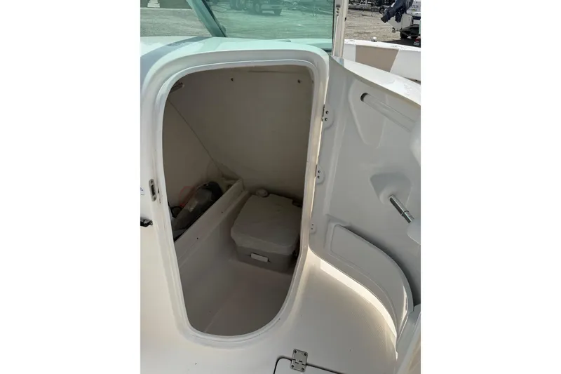 Slide: The Image of 2019 Robalo R207 Dual Console boat interior storage compartment. - 15