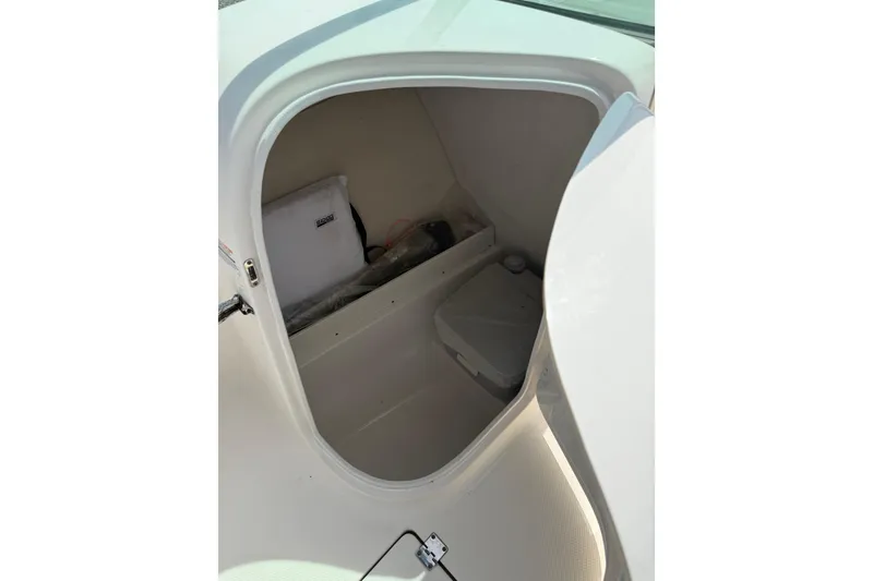 Slide: The Image of 2019 Robalo R207 Dual Console storage compartment interior view. - 17