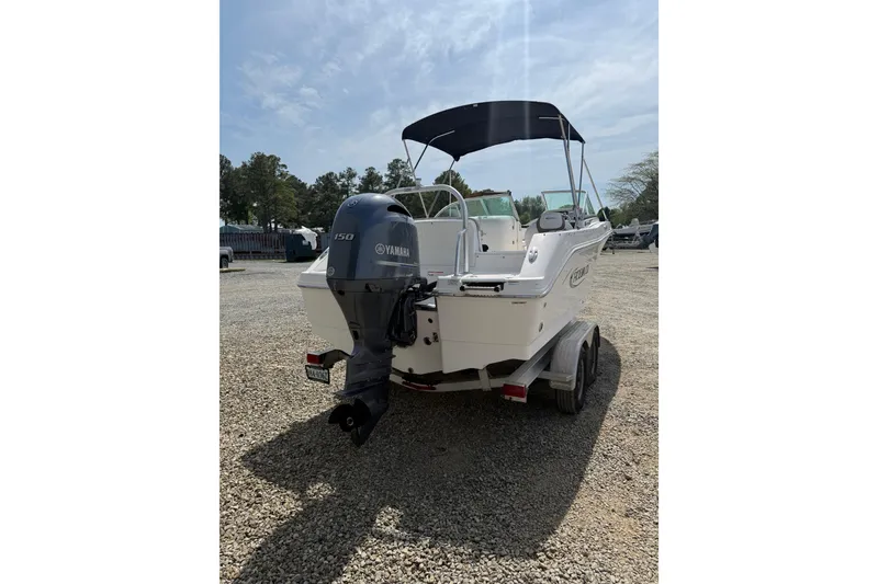 Slide: The Image of 2019 Robalo R207 Dual Console boat with Yamaha 150 engine on trailer. - 21