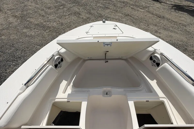 Slide: The Image of 2019 Robalo R207 Dual Console boat interior with open storage compartments. - 9