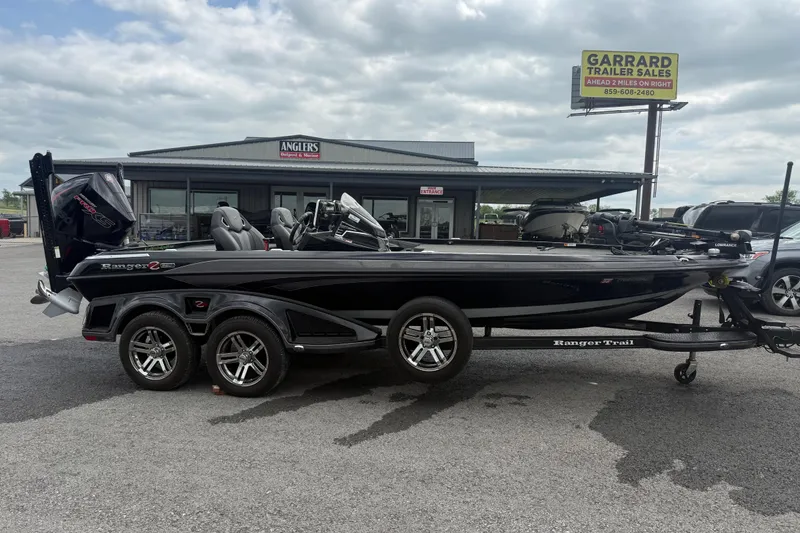The Image of 2024 Ranger Z520R boat on trailer at dealership, overcast sky. - 1