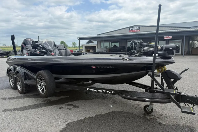 Slide: The Image of 2024 Ranger Z520R boat on trailer outside Angler's Outpost & Marine. - 3