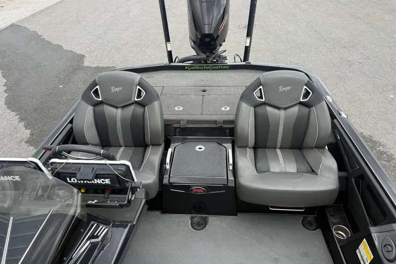 Slide: The Image of 2024 Ranger Z520R boat interior with dual seats and Lowrance equipment. - 7