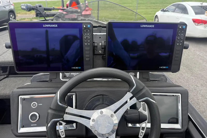 Slide: The Image of 2024 Ranger Z520R boat dashboard with dual Lowrance HDS12 displays and steering wheel. - 8