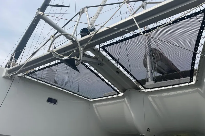 Slide: The Image of 2016 Lagoon 450 F catamaran with netting and rigging details. - 13