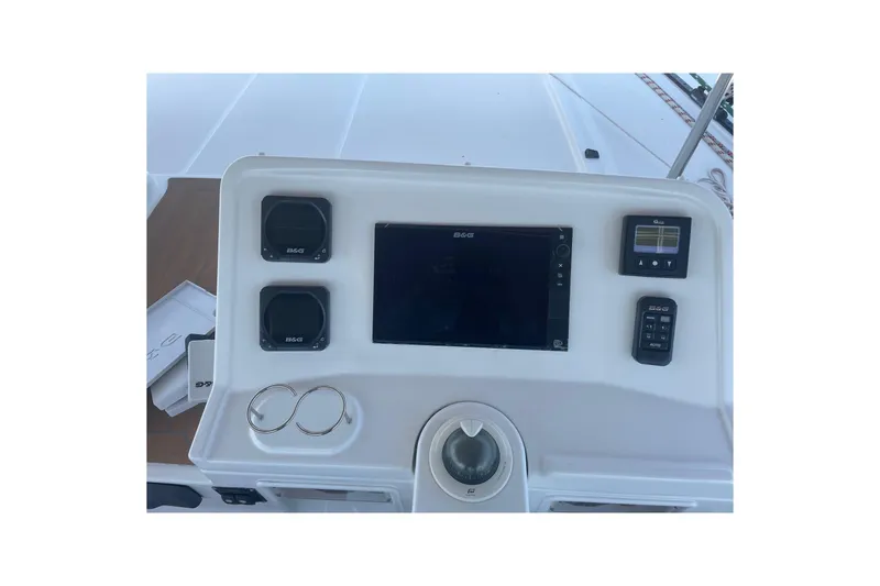 Slide: The Image of Control panel of a 2016 Lagoon 450 F catamaran with navigation instruments. - 21