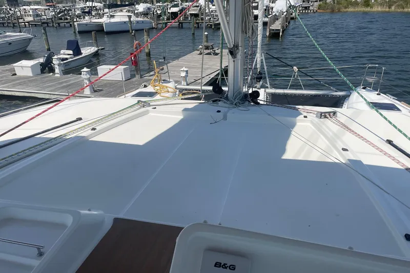 Slide: The Image of Lagoon 450 F catamaran deck, docked at marina, 2016 model, with visible rigging and ropes. - 23