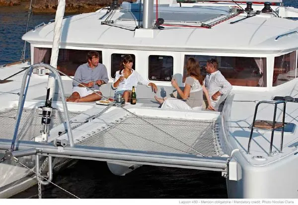 Slide: The Image of Interior of 2016 Lagoon 450 F catamaran with dining area and kitchenette. - 3