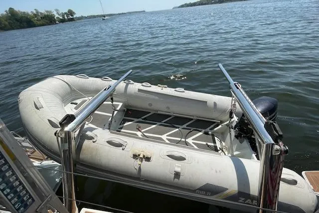Slide: The Image of Inflatable dinghy on Lagoon 450 F yacht, 2016 model, floating on a serene lake. - 31