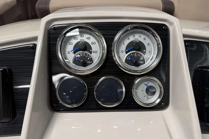 Slide: The Image of Dashboard of 2026 Sylvan Mirage 8520 Cruise PTS Tritoon with gauges and controls. - 11