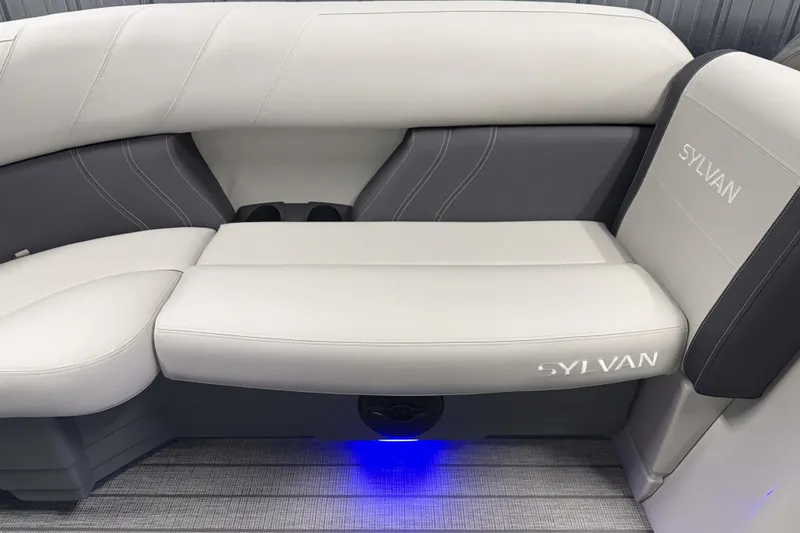 Slide: The Image of 2026 Sylvan Mirage 8520 Cruise PTS Tritoon interior seating with elegant design and ambient lighting. - 16