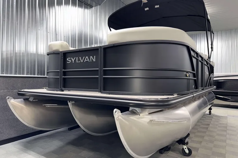 Slide: The Image of 2026 Sylvan Mirage 8520 Cruise PTS Tritoon in showroom, showcasing sleek design and modern features. - 19