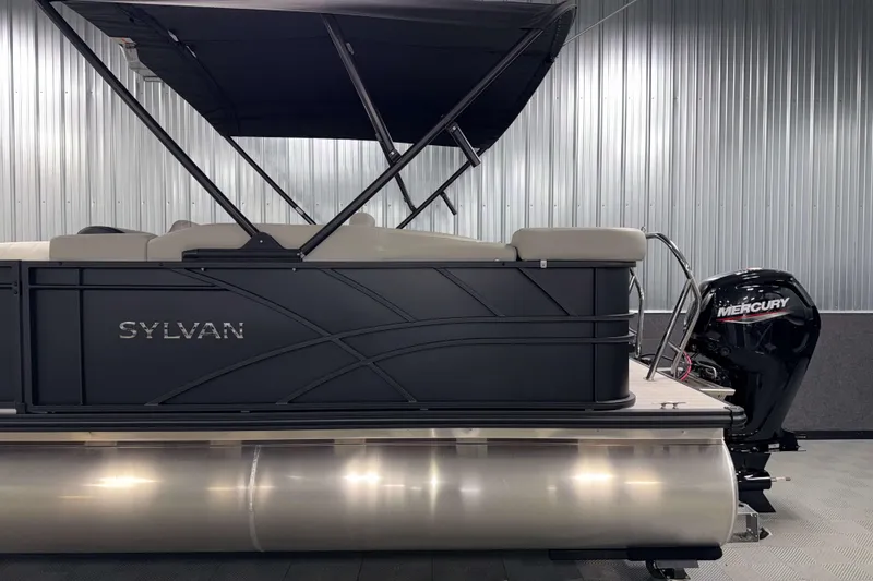 Slide: The Image of 2026 Sylvan Mirage 8520 Cruise PTS Tritoon with Mercury engine in showroom. - 22