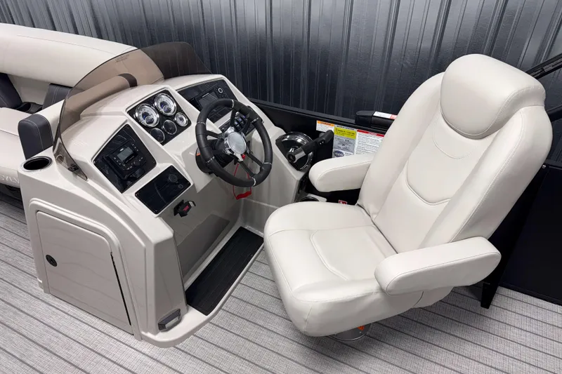 Slide: The Image of Captain's chair and helm of 2026 Sylvan Mirage 8520 Cruise PTS Tritoon boat. - 5