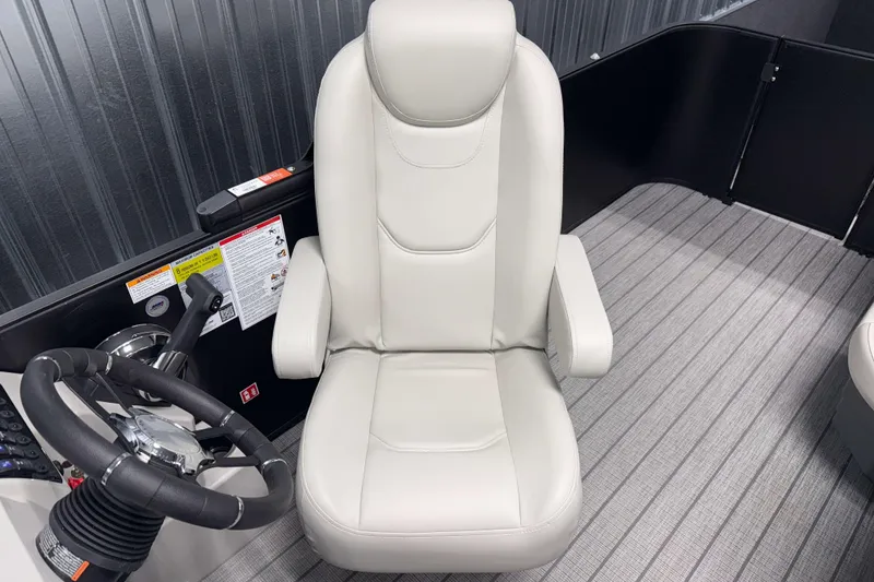 Slide: The Image of Captain's chair and steering wheel of 2026 Sylvan Mirage 8520 Cruise PTS Tritoon boat. - 7