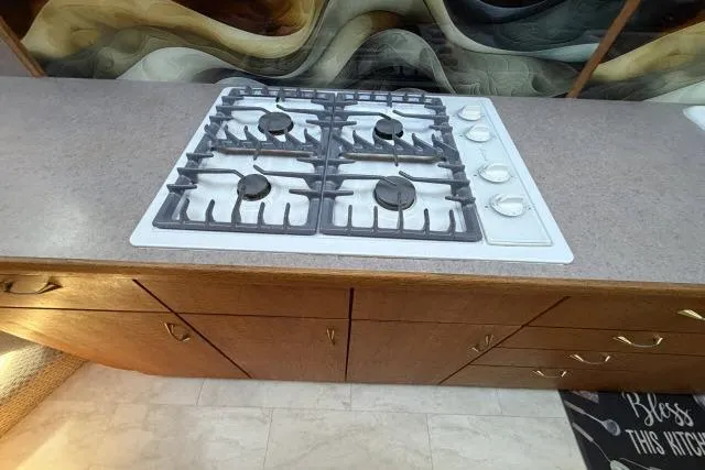 Slide: The Image of Gas stove on a 1986 Fexas Custom 57 yacht kitchen countertop. - 11