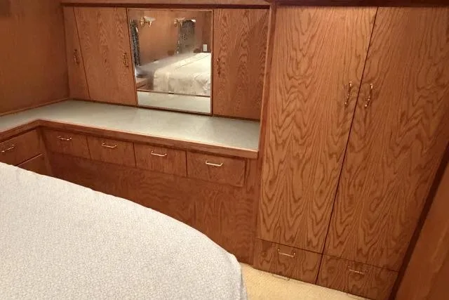Slide: The Image of Wooden cabinetry and mirror in 1986 Fexas Custom 57 interior bedroom. - 19