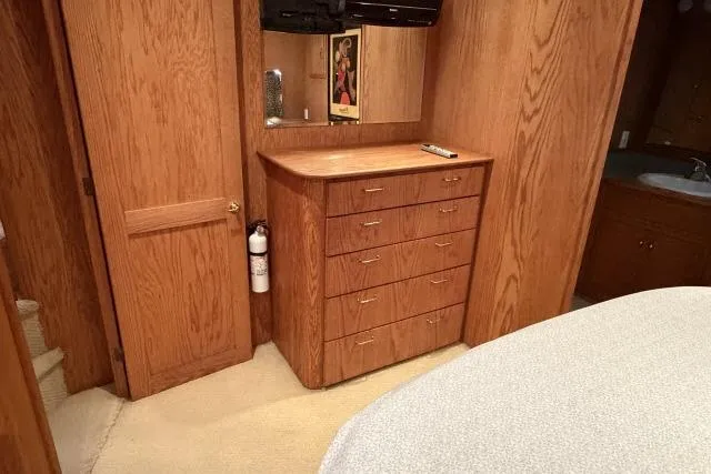 Slide: The Image of Wooden interior of 1986 Fexas Custom 57 yacht with dresser and mirror. - 20
