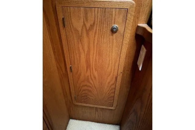 Slide: The Image of Wooden cabinet door inside 1986 Fexas Custom 57 yacht interior. - 29