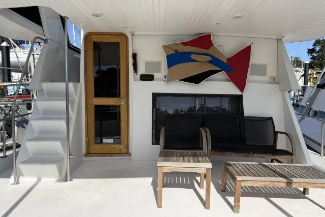 Slide: The Image of Outdoor seating area on 1986 Fexas Custom 57 yacht with modern decor. - 32