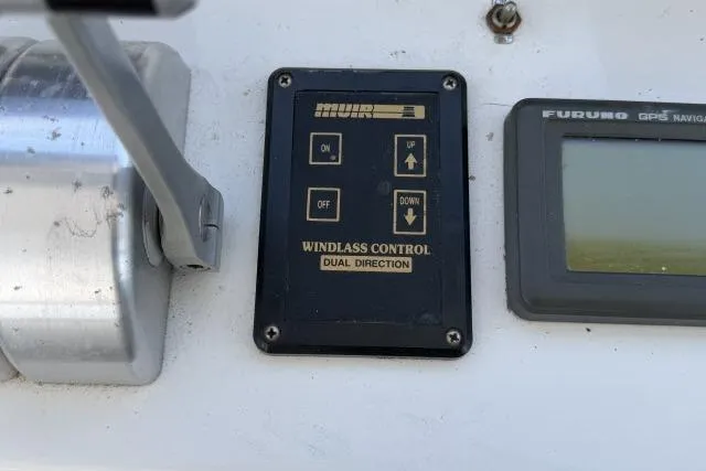 Slide: The Image of Windlass control panel on 1986 Fexas Custom 57 boat dashboard. - 39