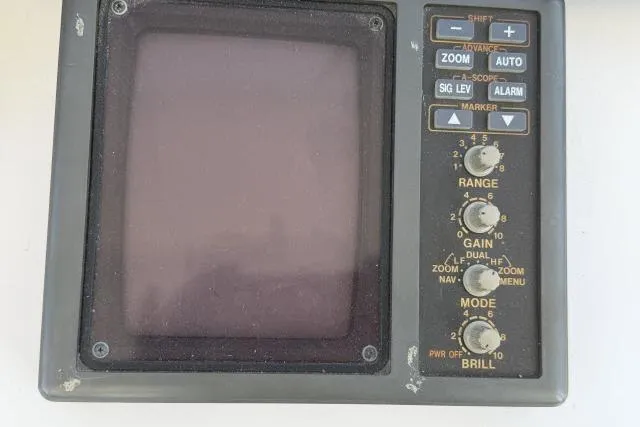 Slide: The Image of Vintage control panel from a 1986 Fexas Custom 57 boat, featuring various knobs and buttons. - 41