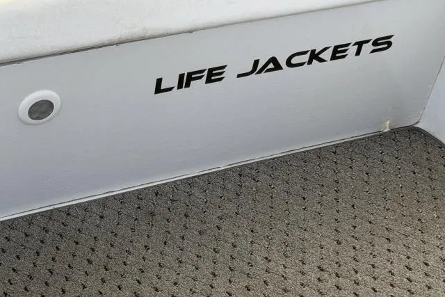 Slide: The Image of Storage compartment labeled "Life Jackets" on 1986 Fexas Custom 57 boat. - 42