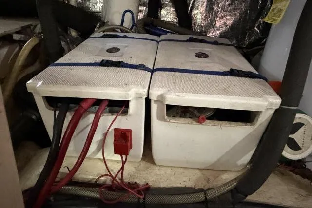 Slide: The Image of Battery compartment of 1986 Fexas Custom 57 boat with cables and wiring. - 61