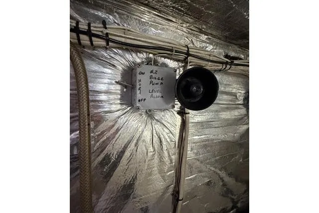 Slide: The Image of Bilge pump level alarm in 1986 Fexas Custom 57 boat, with metallic insulation background. - 63