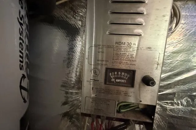 Slide: The Image of Battery charger in a 1986 Fexas Custom 57 boat, showing DC amperes gauge. - 67