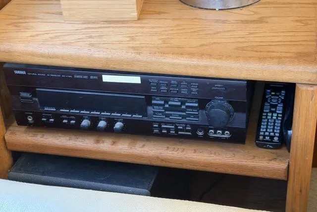 Slide: The Image of 1986 Fexas Custom 57 yacht interior with Yamaha audio system and remote control. - 7