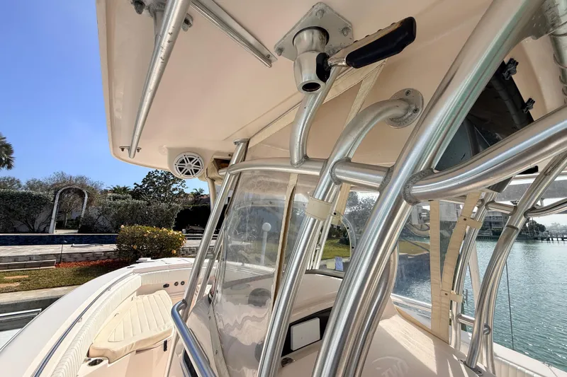 Slide: The Image of 2013 Grady-White Canyon 306 boat with stainless steel railings and clear canopy. - 26