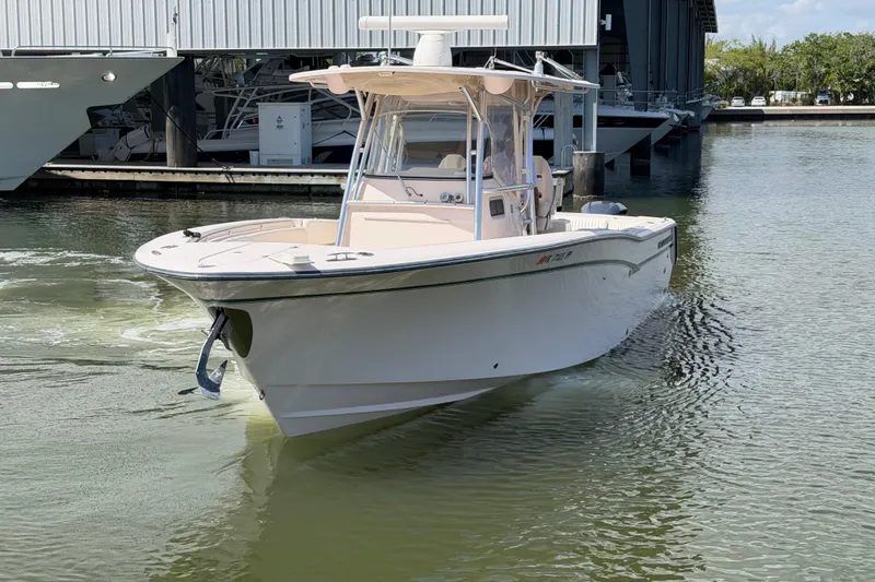 Slide: The Image of 2013 Grady-White Canyon 306 boat docked in marina, front view. - 3